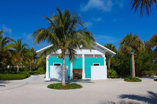 Beach on Ocean Cay Bahamas Island with a colorful houses and turquoise water