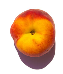 a fresh juicy peach lies on a white background