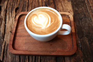 Cappuccino cup an wooden tray, close up - 515038217