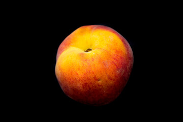 Fototapeta na wymiar a juicy peach lies on a black background