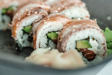 Unagi roll with eel, salmon, avocado, rice, nori, and philadelphia cheese