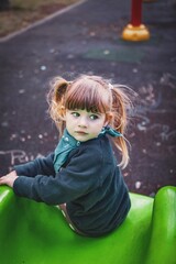 little girl is happy on the playground in bukarest romania 