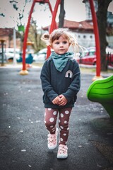little girl is happy on the playground in bukarest romania 