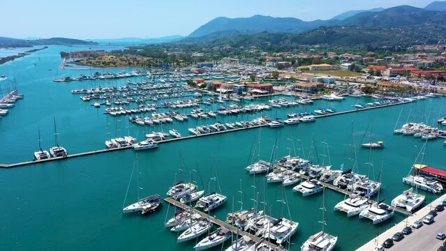 Lefkada, Greece. Aerial view of Lefkada town and marina on the Ionian island. Sailboats in the harbour. Beautiful city on the sea side. Old town. Top view of the marina on coastline. Bird eye