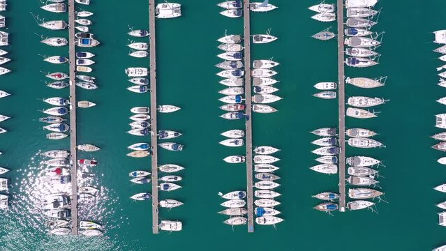 Lefkada, Greece. Aerial view of Lefkada town and marina on the Ionian island. Sailboats in the harbour. Beautiful city on the sea side. Old town. Top view of the marina on coastline. Bird eye