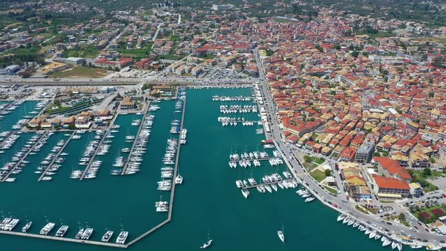 Lefkada, Greece. Aerial view of Lefkada town and marina on the Ionian island. Sailboats in the harbour. Beautiful city on the sea side. Old town. Top view of the marina on coastline. 