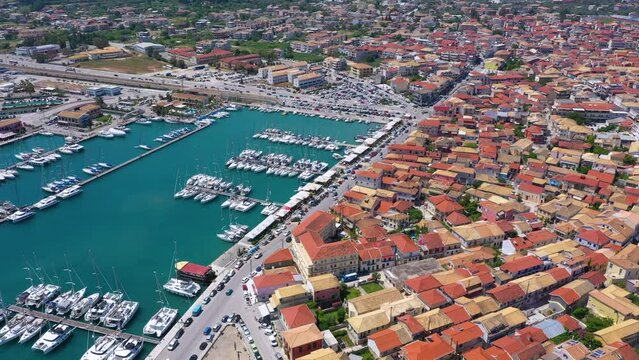 Lefkada, Greece. Aerial view of Lefkada town and marina on the Ionian island. Sailboats in the harbour. Beautiful city on the sea side. Old town. Top view of the marina on coastline. 