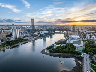 Fototapeta premium Yekaterinburg city and pond aerial panoramic view at summer sunset.