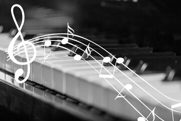 A black piano on a dark background - classical music