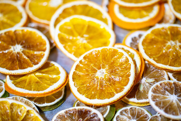 dried citrus fruits on a grey metallic background, space for text. High quality photo