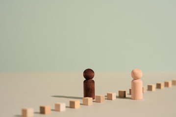 Racial diversity, inclusion and equality concept photo illustration. Two figures facing one another...