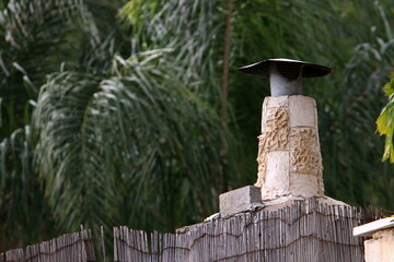 Chimney on the roof of the house
