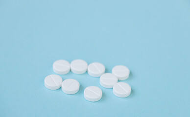 Pills isolated on blue background