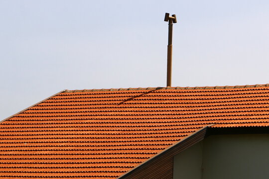 Chimney on the roof of the house