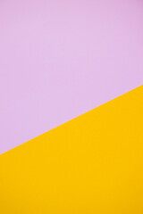 multicolor paper background in pink and yellow