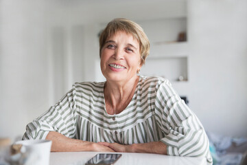  Portrait of positive senior woman with dental braces posing indoors. Copy space. eldrey woman smile with Brackets . - obrazy, fototapety, plakaty