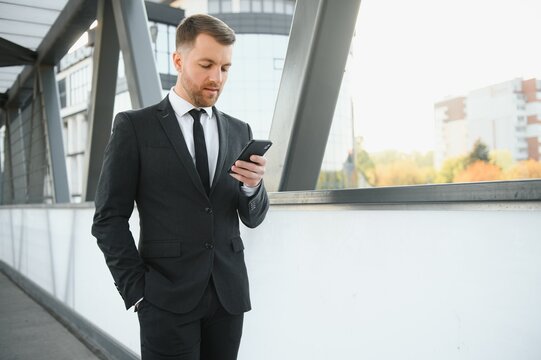 Portrait of an handsome businessman in an urban setting