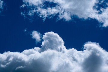 Dense clouds on a blue-sky form patterns. 