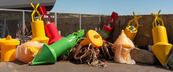 Penzance Harbour, Cornwall, England, UK. 2022. Colourfull selection of plastic buoys for mooring...