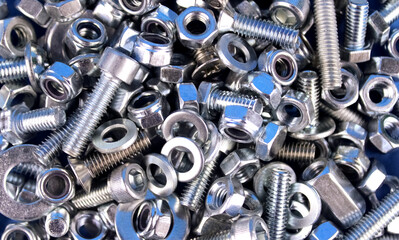 Various metal nuts, bolts and washers for background