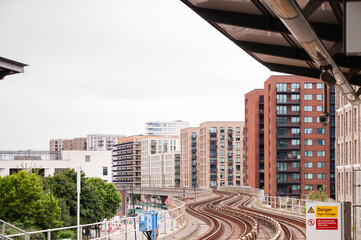DLR Docklands Light Railway train at West Silvertown Station in London. DLR train arriving the...
