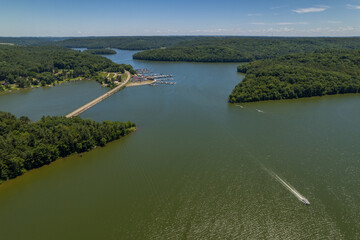 Boat Speeding Away From Marina on Lake