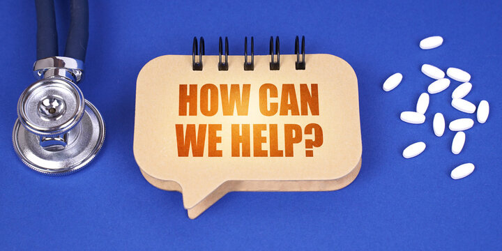 On the blue surface of the tablet, a stethoscope and a notepad with the inscription - how can we help