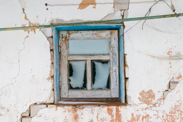 Obraz na płótnie Canvas frozen window of an old building