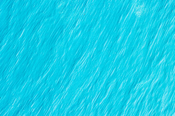 Painted concrete wall, delicate blue color, wavy pattern