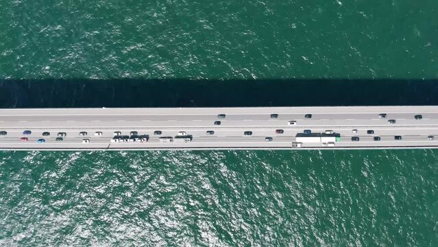 Aerial view above the active traffic at the Great Belt bridge (&Oslash;stbroen) in Denmark, a multi-element fixed link crossing the Great Belt strait between the Danish islands of Zealand and Funen