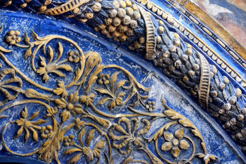 A fragment of a beautiful bas-relief with a floral ornament on the arch above the entrance. Side portal of the northern facade Cathedral of the Archangel (Moscow Kremlin)