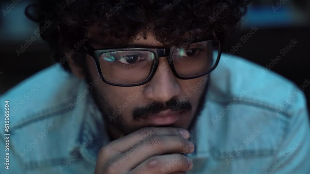 Wall mural indian crypto trader analyst wearing eyeglasses working looking at computer screen reflecting in gla