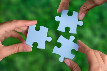 ESG concept of environmental, social, and governance. Hand of people holding a piece of jigsaw...
