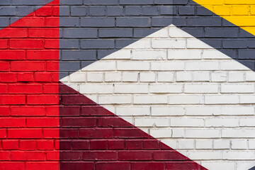 Colorful fragment of painted brick wall. Abstract creative background