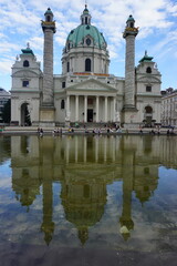 Fototapeta na wymiar Reflection of Karlskirche, a cathedral in Vienna, Austria