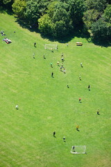 Fototapeta na wymiar A football match seen from above in Donaupark, Vienna