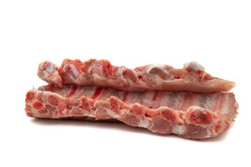 Two pieces of raw pork ribs. Isolated on white background. Highly demanded meat for barbecues.