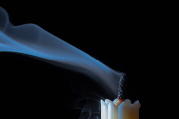 Blowing Out A Burning Candle in Macro