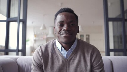 Happy African young man online teacher, coach, distance worker waving hand talking to camera or web cam video conference calling in virtual webcam chat meeting by remote video call.