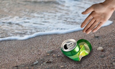 Volunteer man and bottle, clean up day, collecting waste on sea beach, pollution and recycling concept
