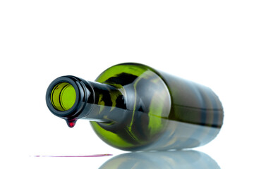 WINE BOTTLE LYING DOWN. ALCOHOL EXCESSIVE CONSUMPTION ADDICTION. ALCOHOLISM CONCEPT. FOCUS SELECTED. WHITE BACKGROUND.