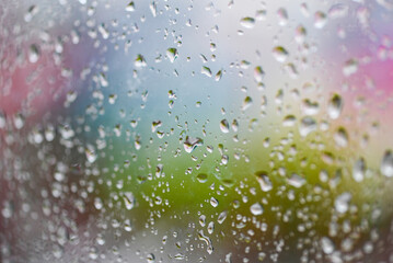 raindrops on glass window in the rainy season, water drop glass background , nature water drop after rain