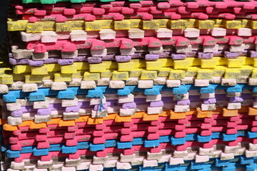 Obraz premium pile of colorful square rugs