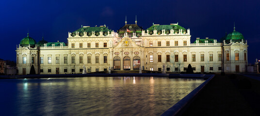 Fototapeta na wymiar Illuminated Vienna's Belvedere at night. Baroque style palace.