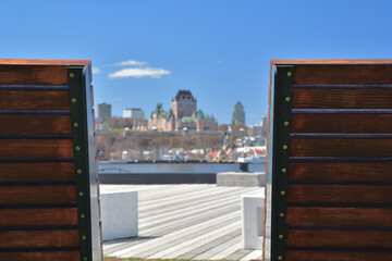 Foreground focus Frontenac castle Quebec city seen from Paquet pier Levis. Best place sit and relax...