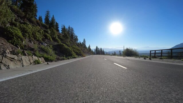 Rear view driving on Lake Mary Road at Mammoth Lakes in the Sierra Nevada Mountains of California.