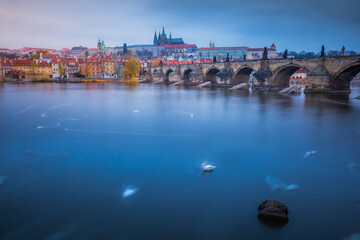 Blurred Vltava river, near Charles Bridge - Prague, Czech Republic
