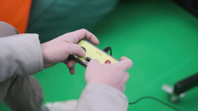 Crop man playing retro videogame