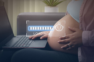 Concept maternity, pregnant woman watching on laptop loading bars 9 months