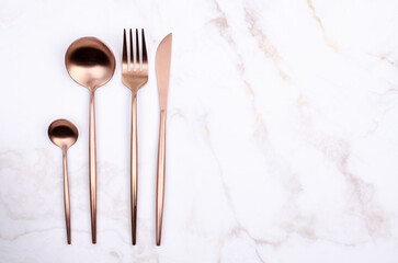 Clean golden metal cutlery